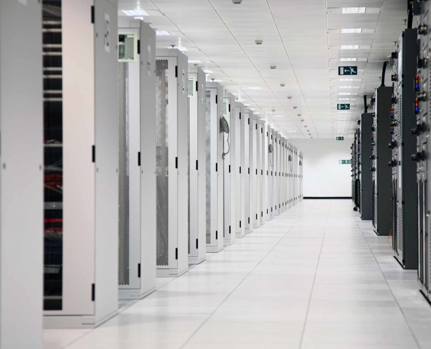 Large white server room with white servers
