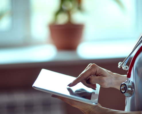 Doctor working on a digital tablet