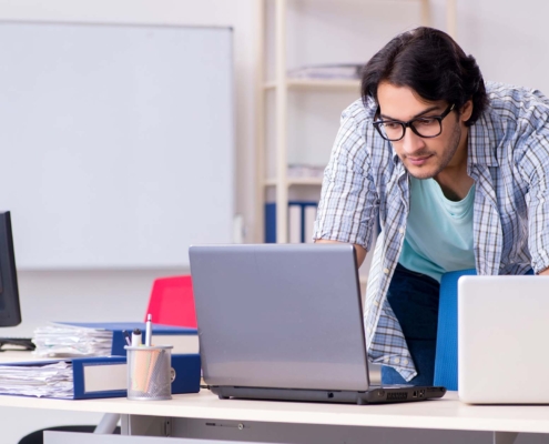 View of IT worker looking over disaster recovery plans