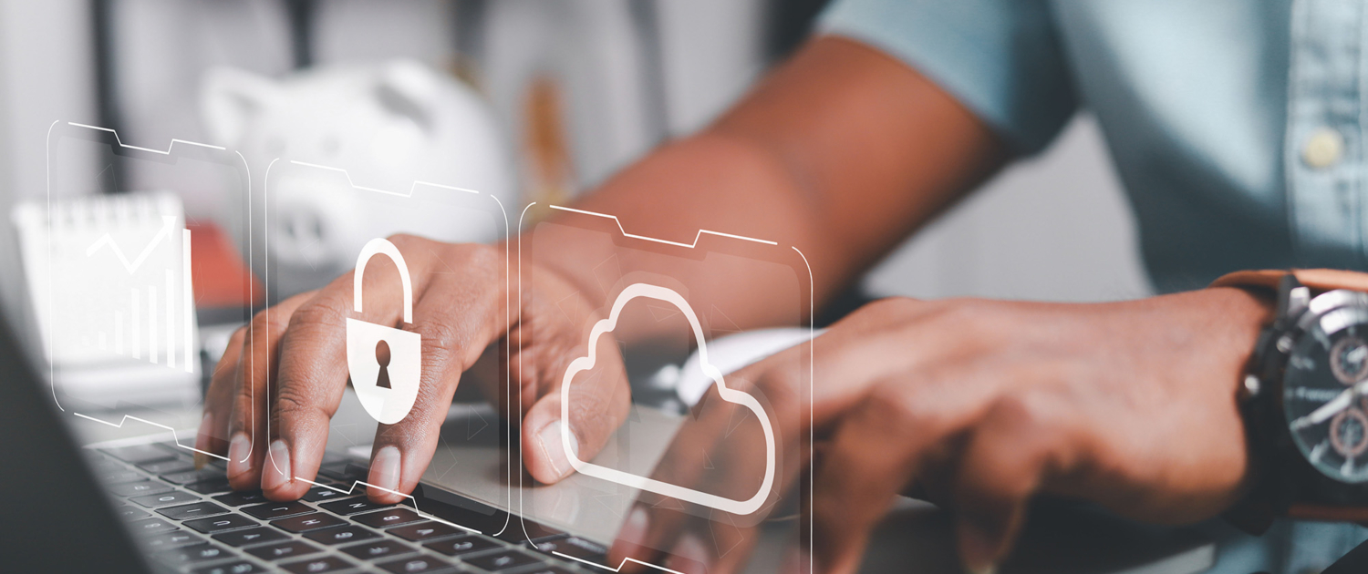 Side view, typing on keyboard with cloud graphics